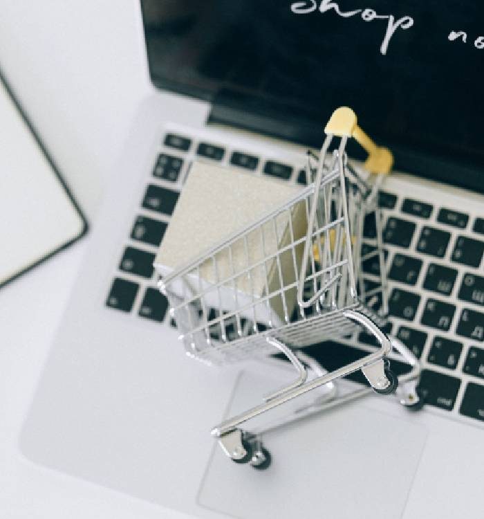 Small shopping cart on a laptop keyboard